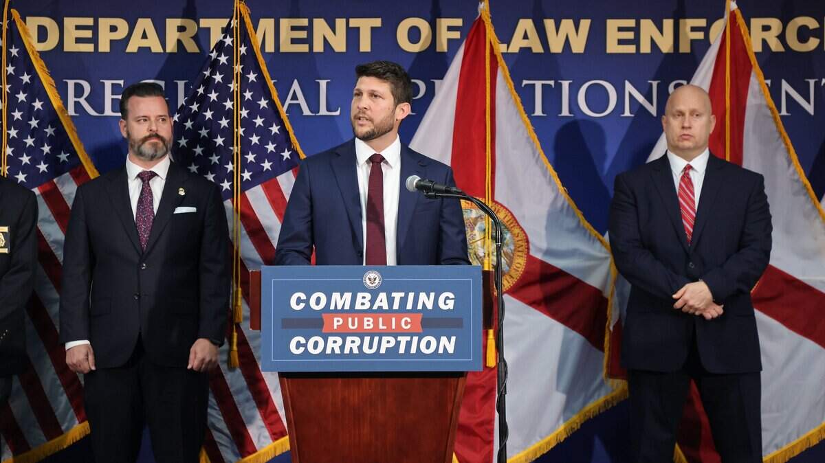 Florida Attorney General James Uthmeier, center, speaks alongside federal and state law enforcement officials during a press conference at the FDLE Miami Regional Operations Center announcing a new unit focused on investigating public corruption and government spending.on Thursday, February 19, 2026, in Miami, Florida. Left to right are: U.S. Attorney for Southern District of Florida Jason A. Reding Quinones, Attorney General James Uthmeier, and Assistant Statewide Prosecutor Richard Mantei, Office of Statewide Prosecution.