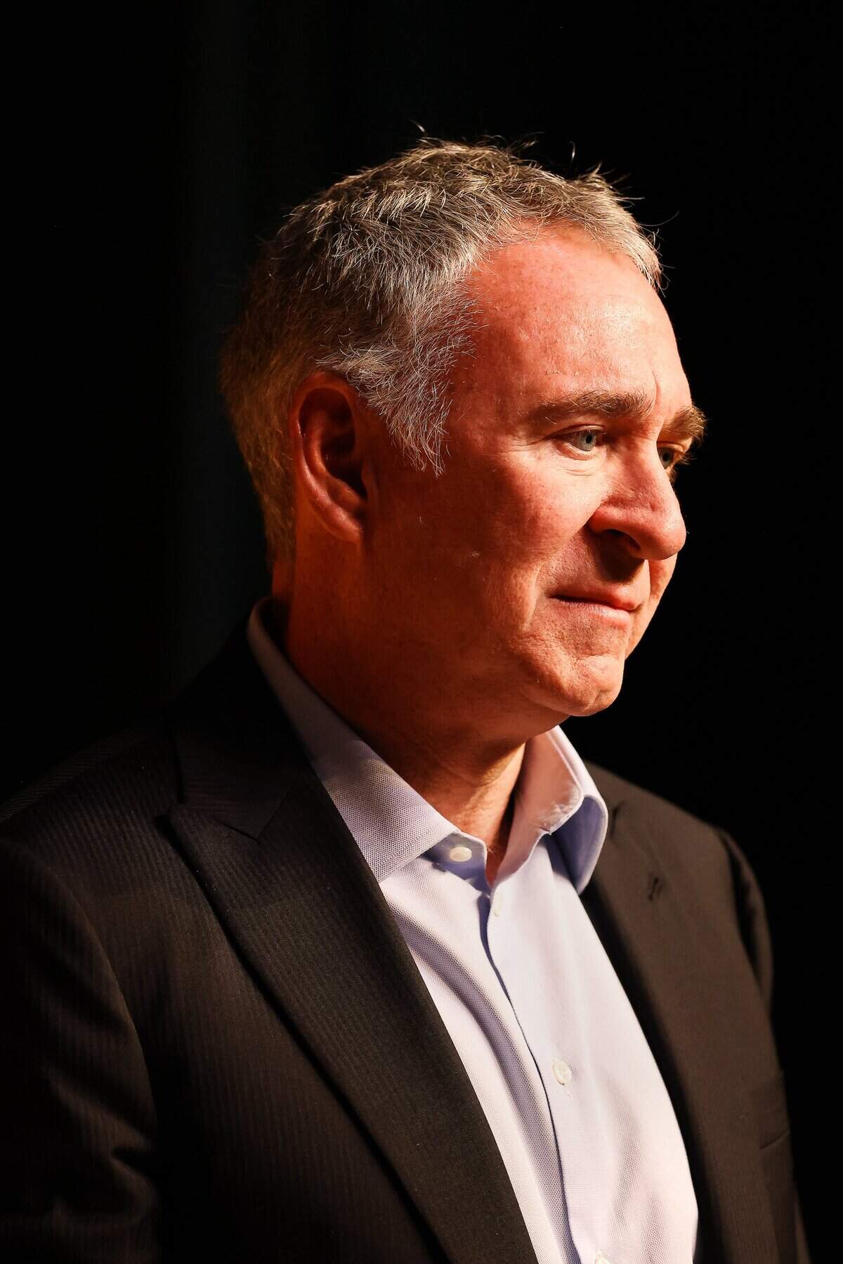 Billionaire Ken Griffin stands on stage after speaking to students during an assembly at Booker T. Washington Senior High School on Tuesday, Feb. 24, 2026, in Miami, Florida.