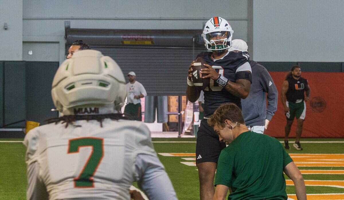 Miami Hurricanes quarterback Darian Mensah (10) throws to wide receiver Daylyn Upshaw (7), during a practice at the Carol Soffer Indoor Practice Facility on the University of Miami campus in Coral Gables, Fl, on Tuesday August 04, 2026.
