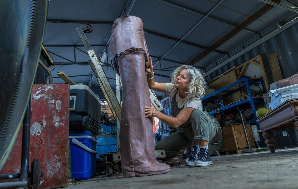 Cuban American sculptor Natalie Plasencia Calvo, who was born in Hialeah and raised in Miami Springs, works on the original clay model, at the R.U.N. Art Foundry, of her Glenn Curtiss Statue that will be on display at the site of the Centennial Legacy Project-the Glenn Curtiss & June Bug Legacy Memorial, to honor aviation pioneer and the City of Miami Springs founder Glenn Hammond Curtiss, in Miami, on Thursday April 16, 2026.