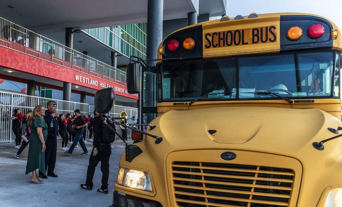 Staff members welcomed students as they arrive by buses at the Westland Hialeah Senior High School, during the first day of school for Miami-Dade County Public Schools (M-DCPS) in the 2025-2026 school year, on Thursday, August 14, 2025.