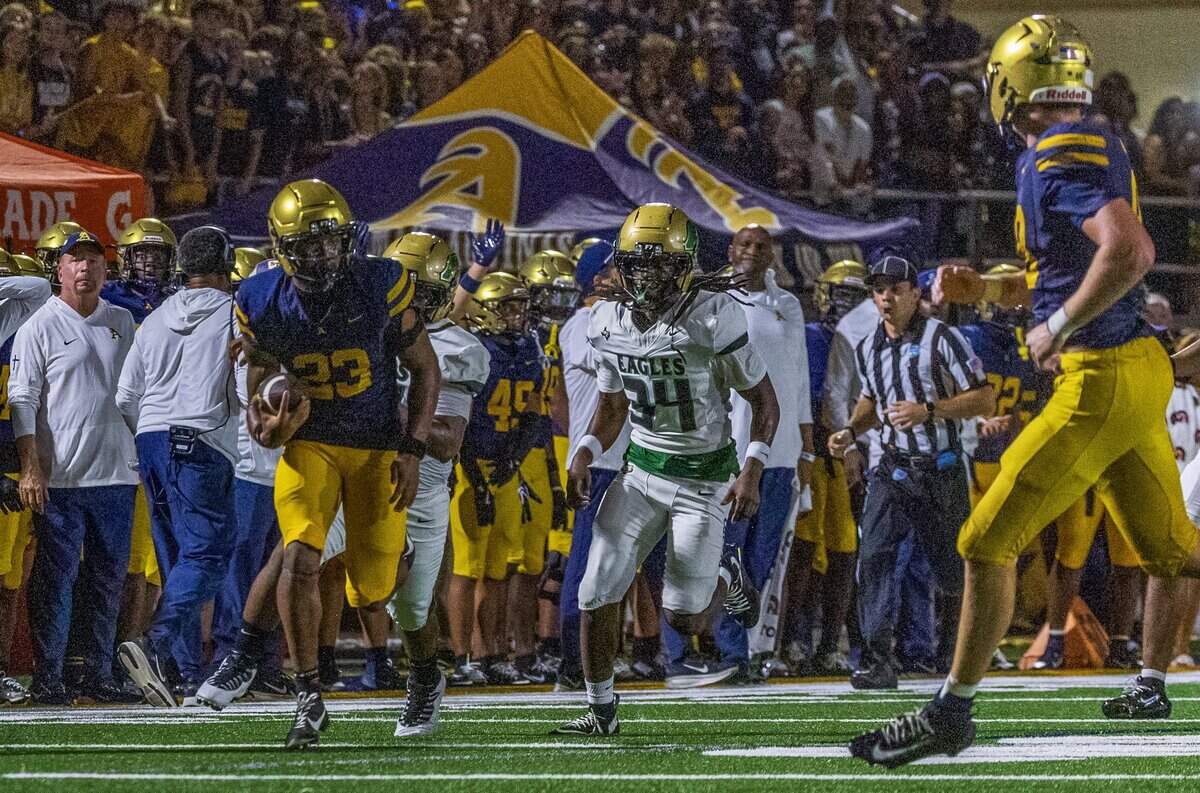 Aquinas' (DB) Zayden Gamble (23) runs for a touchdown chased by Desoto's (DL) Lundyn Green (34), during the first half of a game between St. Thomas Aquinas vs. DeSoto High part of the 2026 Broward County National High School Football Showcase, in Fort Lauderdale , Florida, on Saturday August 29, 2026.
