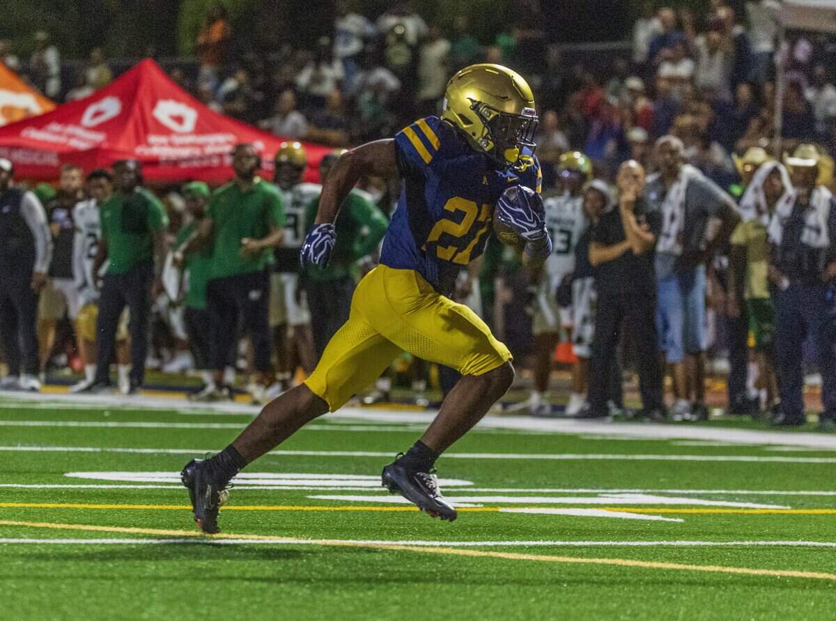 Aquinas' (RB) Collin Francis (27) runs for a touchdown, during the second half of a game between St. Thomas Aquinas vs. DeSoto High part of the 2026 Broward County National High School Football Showcase, in Fort Lauderdale , Florida, on Saturday August 29, 2026.
