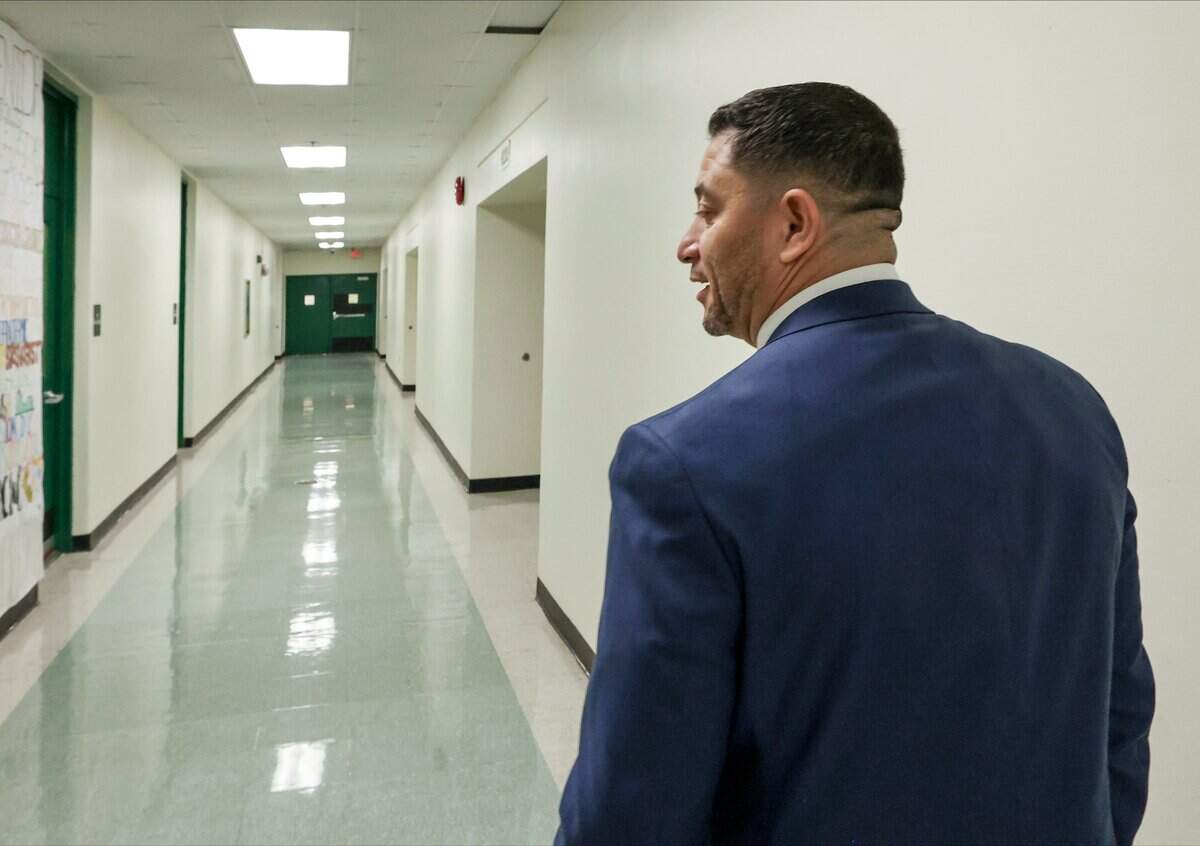 Miami Killian Senior High School Principal Jorge Parra walks the school's hallways as he gives a tour on Monday, Aug. 24, 2026, in Miami. Killian has experienced the fastest-declining enrollment of any public school in Miami-Dade County, losing more than 80% of its students over the past 20 years.