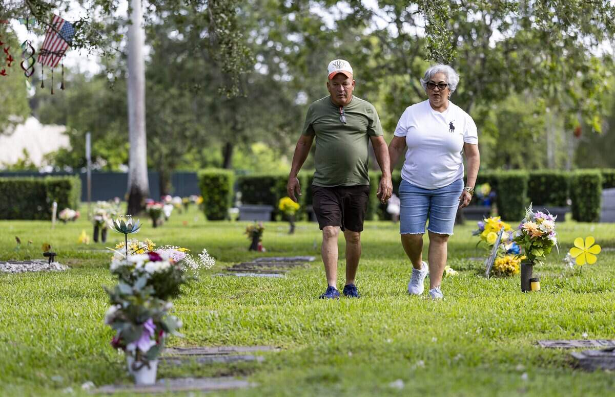 Raunel Sanchez and Vivian Texidor, the parents of the late Raudel Sanchez, visit their son’s gravesite at Caballero Rivero Woodlawn West on Sunday, Aug. 9, 2026, in Miami, Fla. Raudel, 21, was murdered on Aug. 27, 2009. His death remains a cold case, and no one has been arrested in connection with the crime.