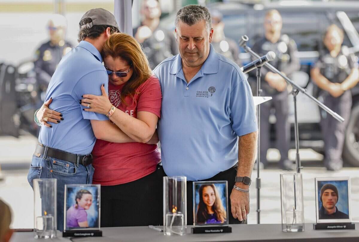 Anthony Montalto, 20, hugs his mother Jennifer Montalto as his father Tony Montalto views an image of his daughter Gina Montalto who was killed during the mass shooting at Marjory Stoneman Douglas High School on February 14, 2018. Families and friends of the victims gathered outside of Eagles’ Haven for the 8th annual Forever in Our Hearts Commemoration on Saturday, February 14, 2026.