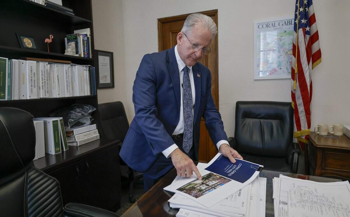 Coral Gables City Manager Peter J. Iglesias looks through renovation and restoration plans at City Hall on Wednesday, March 4, 2026.