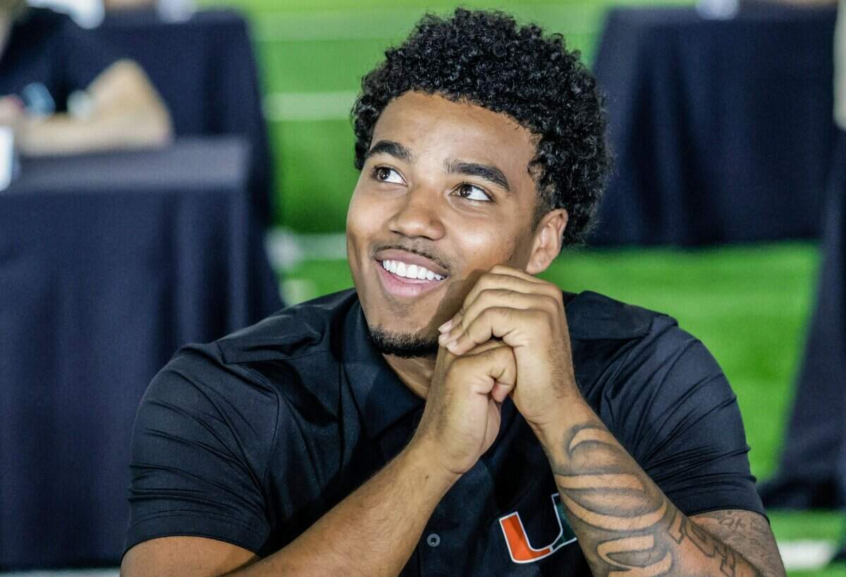 Miami Hurricanes quarterback Darian Mensah (10) speaks to reporters during UM's football media day on campus at the Carol Soffer Indoor Practice Facility in Coral Gables, Florida, on Monday, August 3, 2026.
