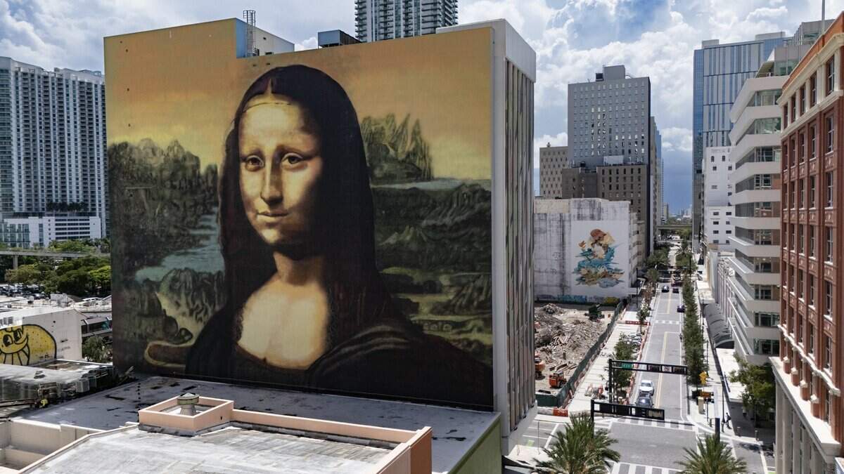 A massive multi-story outdoor mural of the Mona Lisa watches over East Flagler street recently reopened after years of on-off construction in downtown Miami on Tuesday, August 4, 2026.