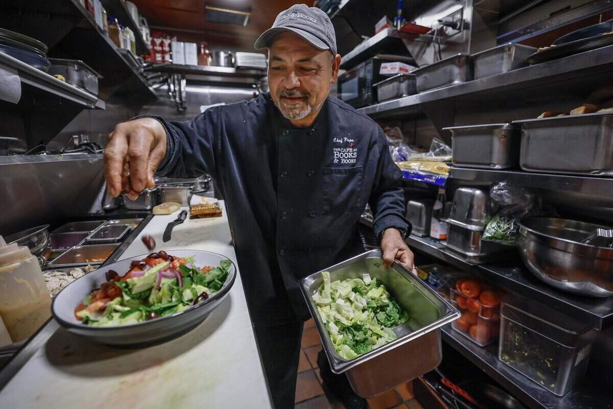 Chef Papo Santiago, prepares a meal in the kitchen at The Café at Books & Books in Coral Gables, Florida, on Tuesday, August 4, 2026.