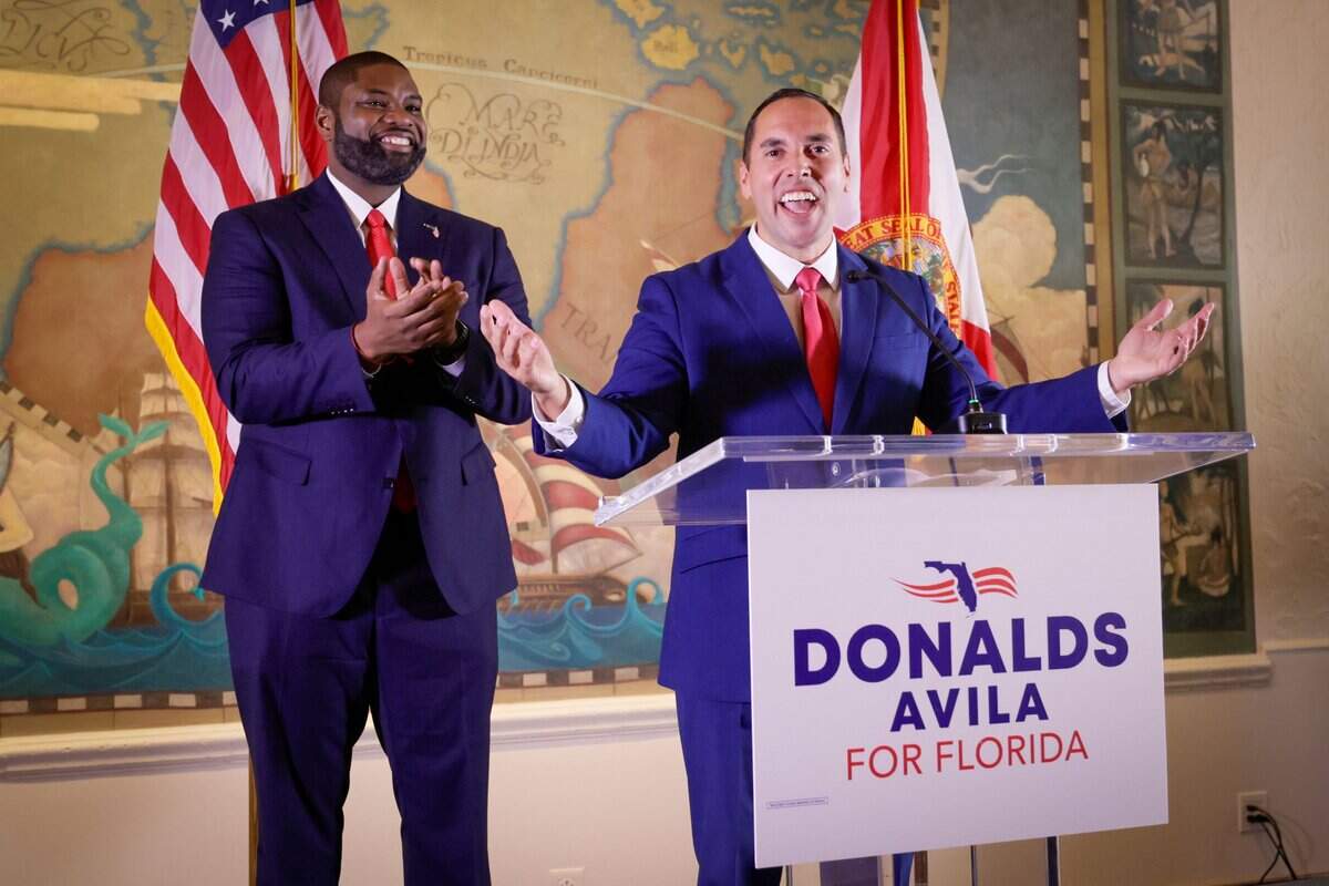 U.S. Rep. Byron Donalds stands behind his newly announced running mate, state Sen. Bryan Ávila, at the Freedom Tower in downtown Miami.