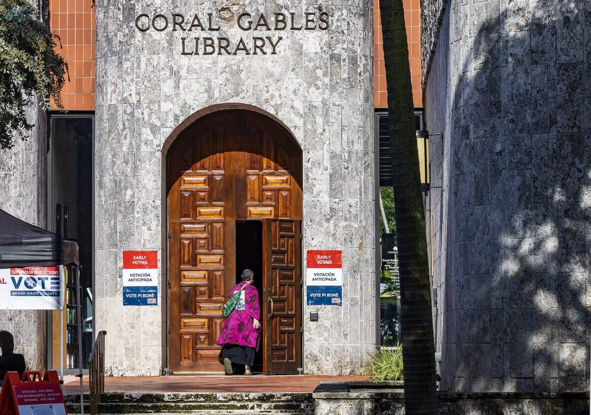 Residents walk inside of the Coral Gables Branch Library poll site to vote during the last weekend of early voting, looking ahead to Tuesday's election, on Saturday August 15, 2026.