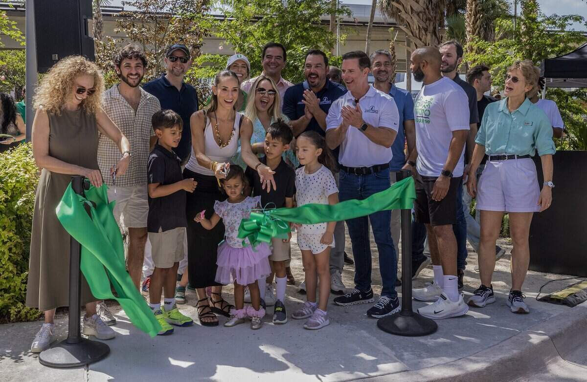 A group of elected officials and community members joined South Miami resident Nikki Spoelstra (center) with her children, during the Nikki Spoelstra Play Forest Grand Opening ribbon cutting ceremony, in South Miami's section of The Underline, sponsored by Mrs. Spoelstra, on Saturday August 15, 2026.
