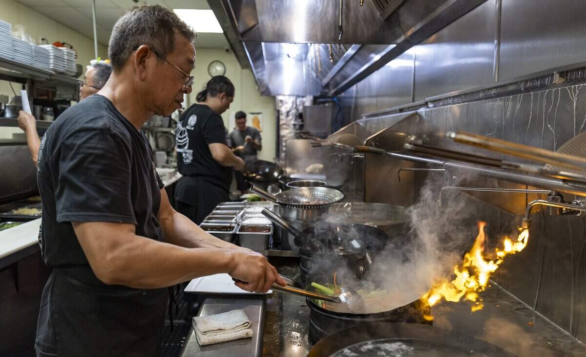 Chef Yurn prepares Szechuan Beef at Wan's Mandarin House on Wednesday, Aug. 19, 2026, in Fort Lauderdale, Fla.