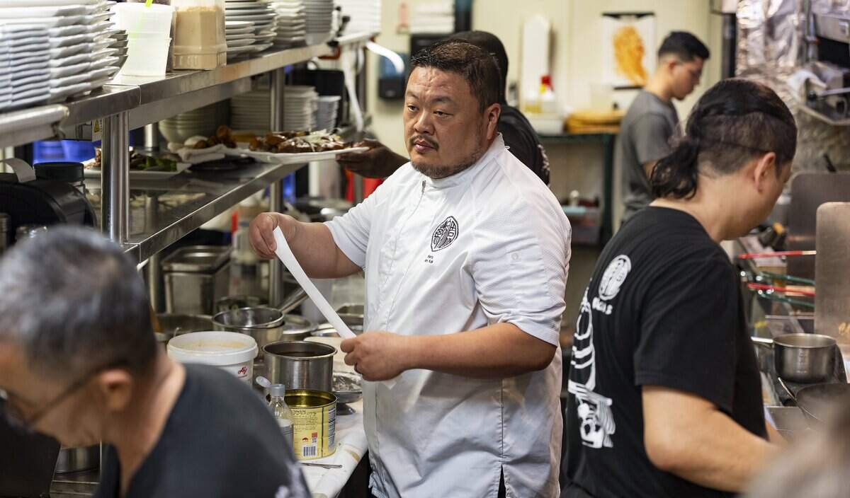 Chef Alex Kuk looks at orders being prepared at his restaurant, Wan's Mandarin House, on Wednesday, Aug. 19, 2026, in Fort Lauderdale, Fla.