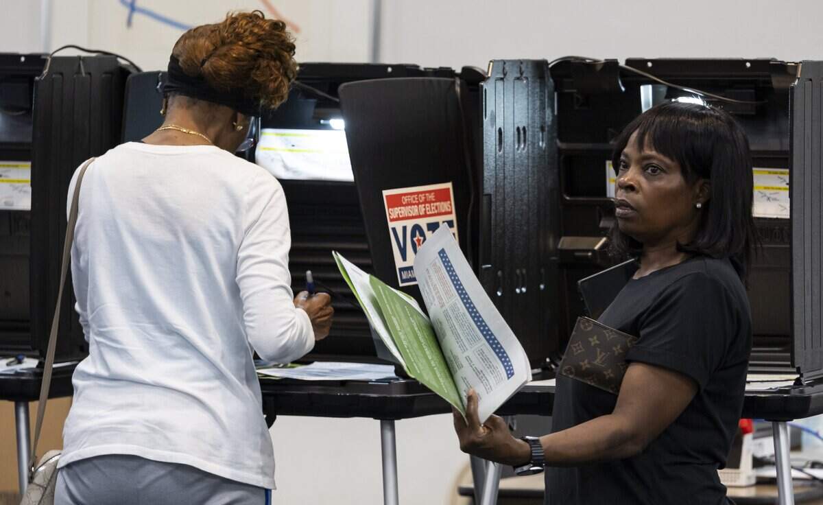 Early voters fill out their ballots at the North Dade Regional Library on Saturday, Aug. 15, 2026, in Miami Gardens, Fla.