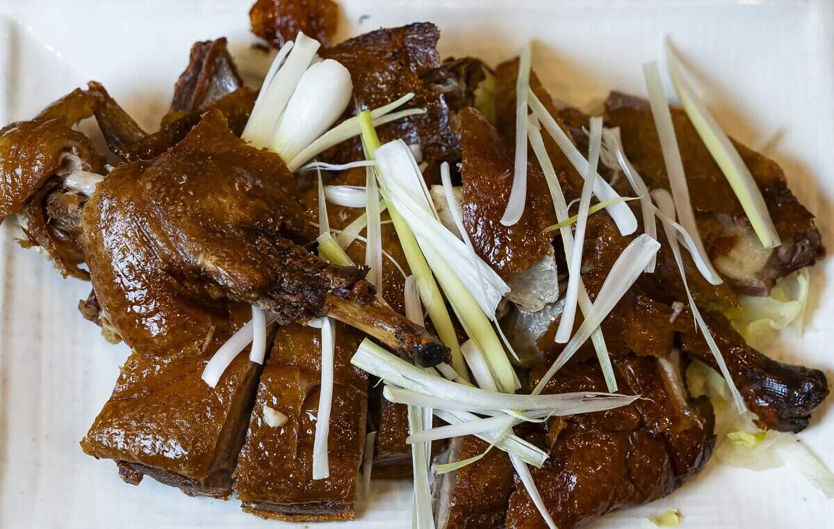 Chef Alex Kuk prepared Roast Duck at his restaurant, Wan's Mandarin House, on Wednesday, Aug. 19, 2026, in Fort Lauderdale, Fla.
