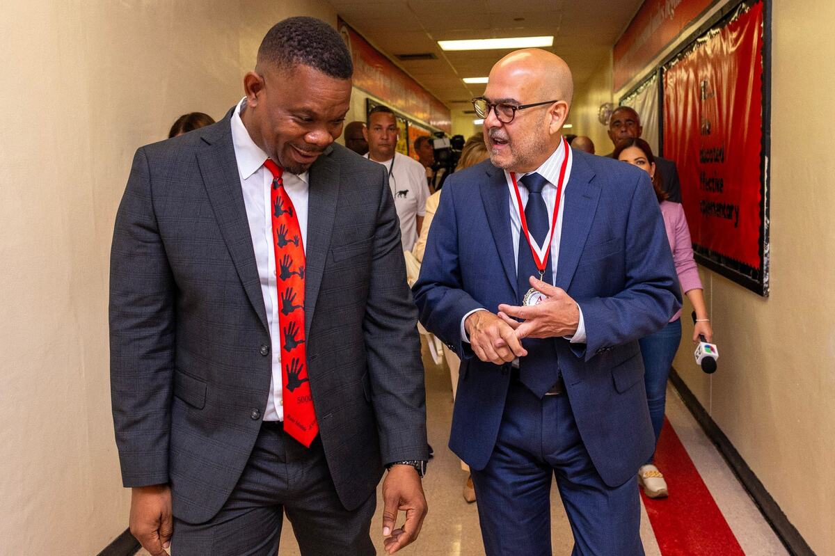 Superintendent of Miami-Dade County Public Schools Jose L. Dotres, right, speaks with Principal James Dominique, left, during the first day of school at Miami Edison High on Thursday, August 15, 2024, in Miami, Fla.