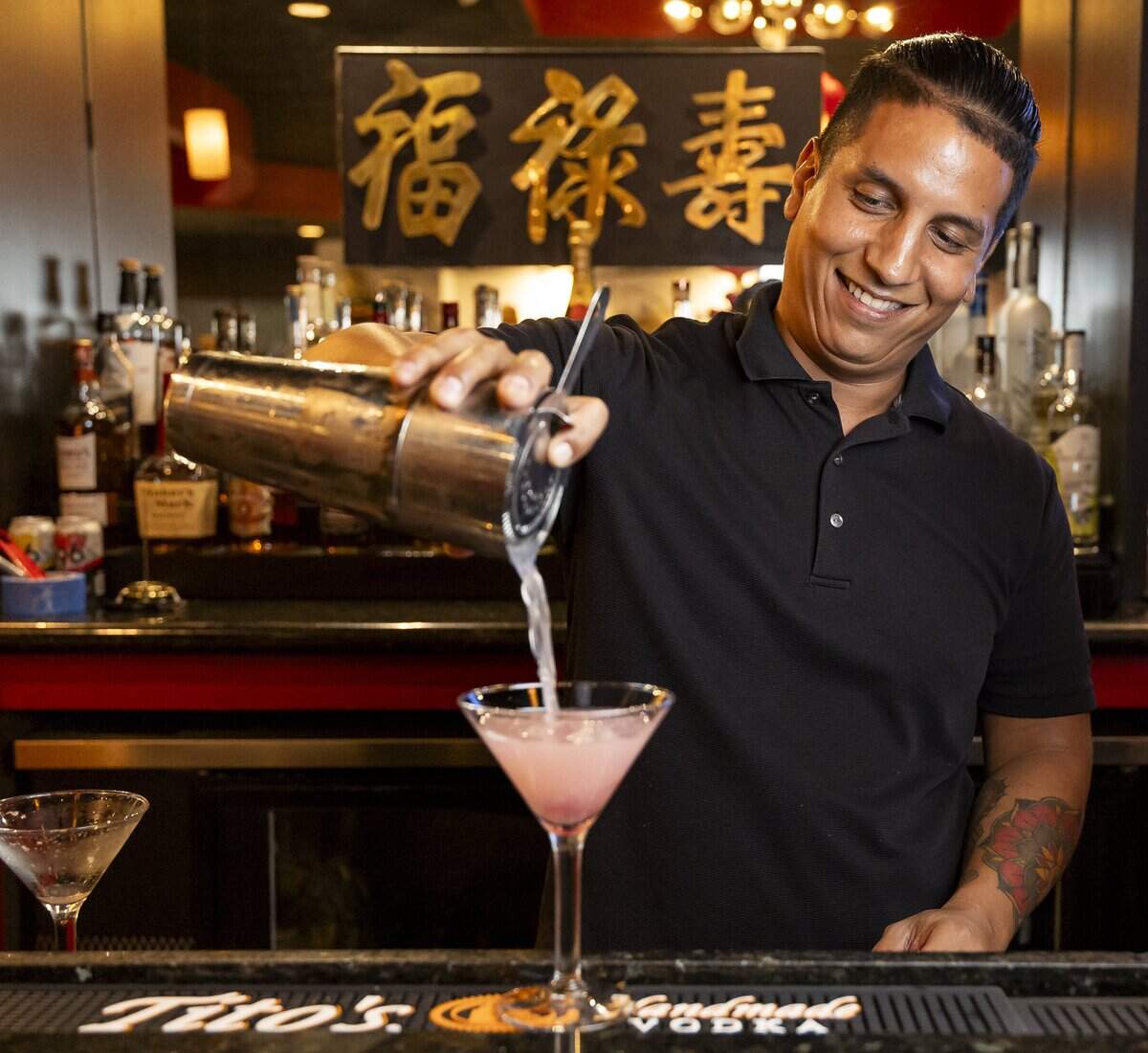 Bartender Jesse Gil prepares a Cherry Blossom Martini at Wan's Mandarin House on Wednesday, Aug. 19, 2026, in Fort Lauderdale, Fla.