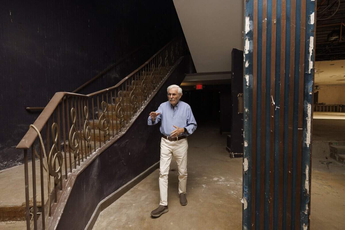 Stu Blumberg, the original general manager, walks through the original entrance way inside the old Playboy Theater on Thursday, Dec. 4, 2025, at the Castle Hotel in Miami Beach, Fla. Jackie Gleason played a role in the design of the theatre. The Blue velvet pillar on the right is the original wall color.
