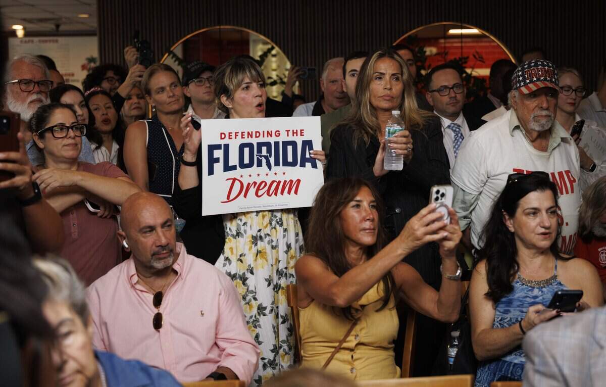 Antedates listen during a campaign event for U.S. Rep. Byron Donalds, running for the Republican nomination for Florida governor, on Monday, Aug. 17, 2026, at El Tropico restaurant in Sunny Isles Beach, Fla.