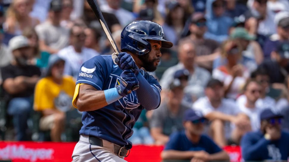Tampa Bay Rays' Cedric Mullins hits an RBI single during the fifth inning of a baseball game against the Seattle Mariners, Sunday, Aug. 9, 2026, in Seattle. (AP Photo/Stephen Brashear)