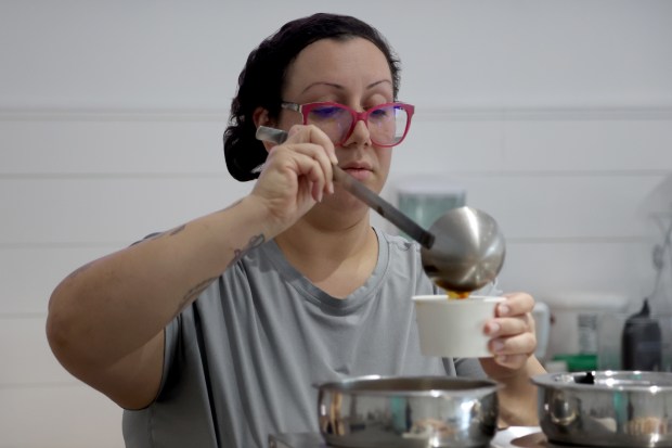 Owner Stephanie Peña packages vegetable soup for an Uber Eats pickup order at Stephanie's Vegan Bakery in Fort Lauderdale in this file photo from 2022 (Amy Beth Bennett/Sun Sentinel).