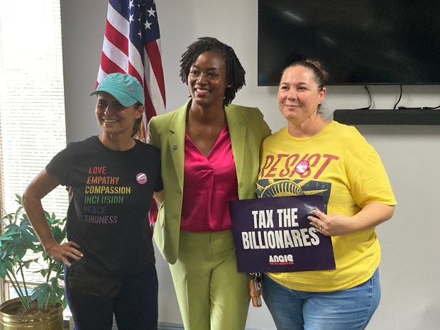 State Rep. Angie Nixon, center, the 2026 Democratic nominee for U.S. Senate in Florida, poses for pictures with supporters Lauren Dressel of Davie, left, and Heather Innusa of Hollywood, right, after Nixon spoke to a group of supporters in Hollywood on Sunday, Aug. 30, 2026. (Anthony Man/South Florida Sun Sentinel)