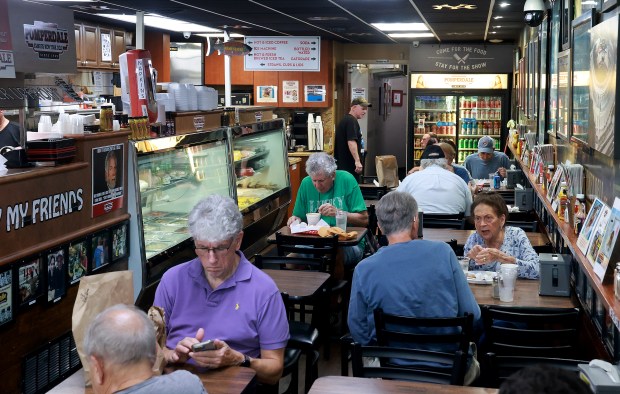 Customers at Pomperdale Famous New York Deli in Fort Lauderdale on Friday, Aug. 7. (Mike Stocker/South Florida Sun Sentinel)