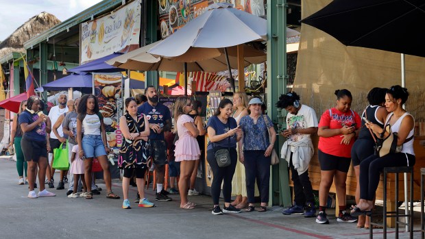 People line up at Roll and Dough at the Yellow Green Farmers Market in Hollywood on Saturday, Aug. 22, 2026. (Mike Stocker/South Florida Sun Sentinel)
