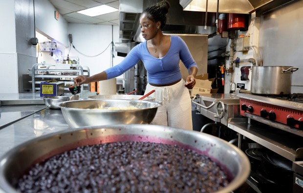 Roll and Dough owner Julie Pierre, of Fort Lauderdale, prepares filling for her popular cinnamon rolls in Sunrise on Tuesday, Aug. 25, 2026. (Carline Jean/South Florida Sun Sentinel)