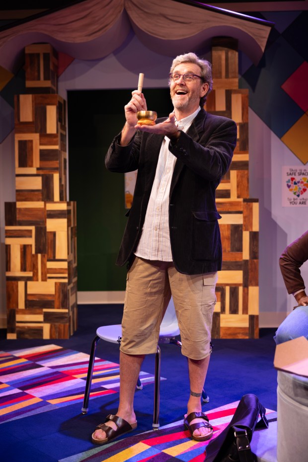 In his role as Don, actor Ted deChatelet starts a meeting by ringing a bell. (Matthew Tippins/Courtesy)