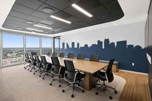 The office blends functionality with elevated design, featuring a mix of open workstations, private offices, and a variety of conference and huddle rooms to support different work styles. (Courtesy of JLL)