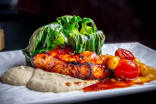 With live entertainment, Lizzy's Live on Sand Lake Road offers something altogether different than the average Magical Dining experience. Pictured here, the miso-glazed salmon entree from their prix-fixe menu. (Photo courtesy Lizzy's Live)