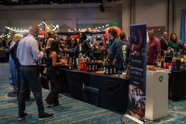 Guests enjoy wines at the Cooper's Hawk setup at last year's Taste! Central Florida, where there are myriad options for wine and cocktails. (Photo courtesy Taste! Central Florida)