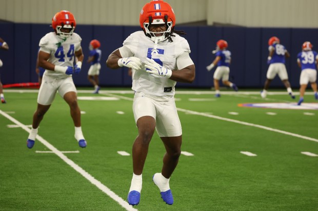Florida linebacker Myles Graham leaps during the Gators' preseason camp at the UF practice facility Aug. 5 in Gainesville. (Stephen M. Dowell/Orlando Sentinel)