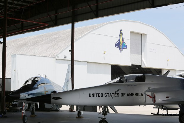 A pair of T-38 jets sit in front of the XLV Hangar at the Shuttle Landing Facility at Kennedy Space Center on Friday, Aug. 14, 2026. They were flown into Florida by NASA astronauts Raja Chari and Deniz Burnham, who were on hand for an event announcing the Max Power air show coming to KSC on Nov. 7-8. (Richard Tribou/Orlando Sentinel)