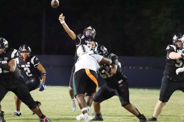 Lake Nona quarterback Eli Nickerson (7) throws during the Evans High at Lake Nona High varsity football game in Orlando on Friday, August 21, 2026. (Stephen M. Dowell/Orlando Sentinel)