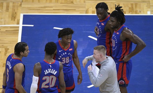 Detroit Pistons assistant coach Sean Sweeney instructs players during the second half of an NBA basketball game against the Orlando Magic, Tuesday, Feb. 23, 2021, in Orlando, Fla. (AP Photo/Phelan M. Ebenhack)