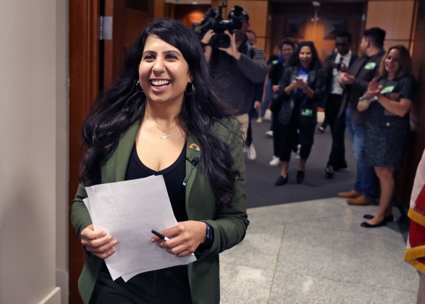 State Rep. Anna Eskamani walks into the city clerk's office with cheering supporters in 2024 to file the official paperwork for her campaign to be the next mayor of Orlando. Eskamani currently represents Central Florida's District 42 in the Florida House. (Joe Burbank/Orlando Sentinel file)