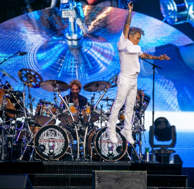 Singer Arnel Pineda of Journey leaps into the air at Camping World Stadium in Orlando on July 10, 2024. (Patrick Connolly/Orlando Sentinel)