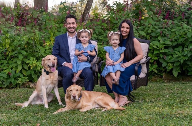 Nick Nesta, who took office as Apopka's new mayor April 28, 2026, sits with his wife, Lauren, and their twin daughters. Their dogs are named Cannoli and Hilo. Nesta served as a city city commissioner from 2022 and won the mayor's job April 14 by a wide margin in a runoff against former Orange County Commissioner Christine Moore. (Courtesy of city of Apopka)