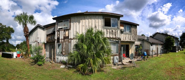Abandoned buildings decay in the Tymber Skan on the Lake Condominiums complex in Orlando, Tuesday, Aug. 25, 2026. The Orange County commission took a big step Tuesday, Aug. 25, 2026, toward formulating a plan for what remains of Tymber Skan on the Lake, a deteriorating community built in the 1970's for working professionals. County officials say the plan includes relocating residents. (Joe Burbank/Orlando Sentinel)