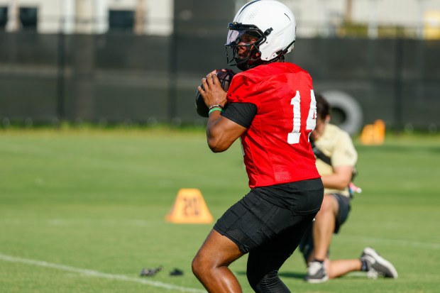 UCF Knights quarterback Alonza Barnett III (#14) runs through drills with the team on the first day of the team's preseason fall camp on Monday, August 3, 2026. (Rich Pope/Orlando Sentinel)