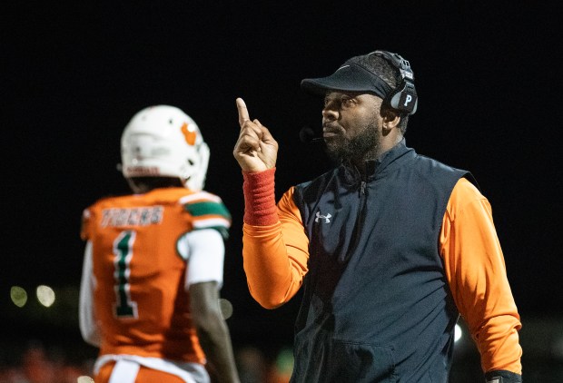 Jones High Schools head coach Elijah Williams coaches his players during their game against Napels High School in the FHSAA football state semifinals football game at Jones High School in Orlando, Fla., Friday, Dec. 6, 2024. (Willie J. Allen Jr./Orlando Sentinel)