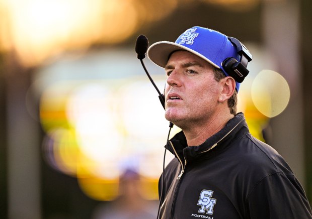 Santa Margarita head coach Carson Palmer looks out to the field as the season-opening game against Mission Viejo begins at Trabuco Hills High School in Mission Viejo on Friday, August 22, 2025. (Photo by Leonard Ortiz, Orange County Register/SCNG)
