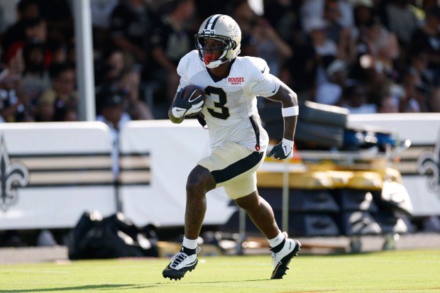METAIRIE, LOUISIANA - AUGUST 13: Travis Etienne Jr. #3 of the New Orleans Saints participates in drills during a joint practice at Ochsner Sports Performance Center on August 13, 2026 in Metairie, Louisiana. (Photo by Tyler Kaufman/Getty Images)