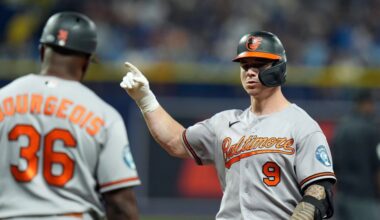 Baltimore Orioles' Tyler O'Neill (9) celebrates with first base coach Jason Bourgeois (36) after his RBI single off Tampa Bay Rays pitcher Bryan Baker during the 10th inning of a baseball game Saturday, Aug. 15, 2026, in St. Petersburg, Fla. (AP Photo/Chris O'Meara)
