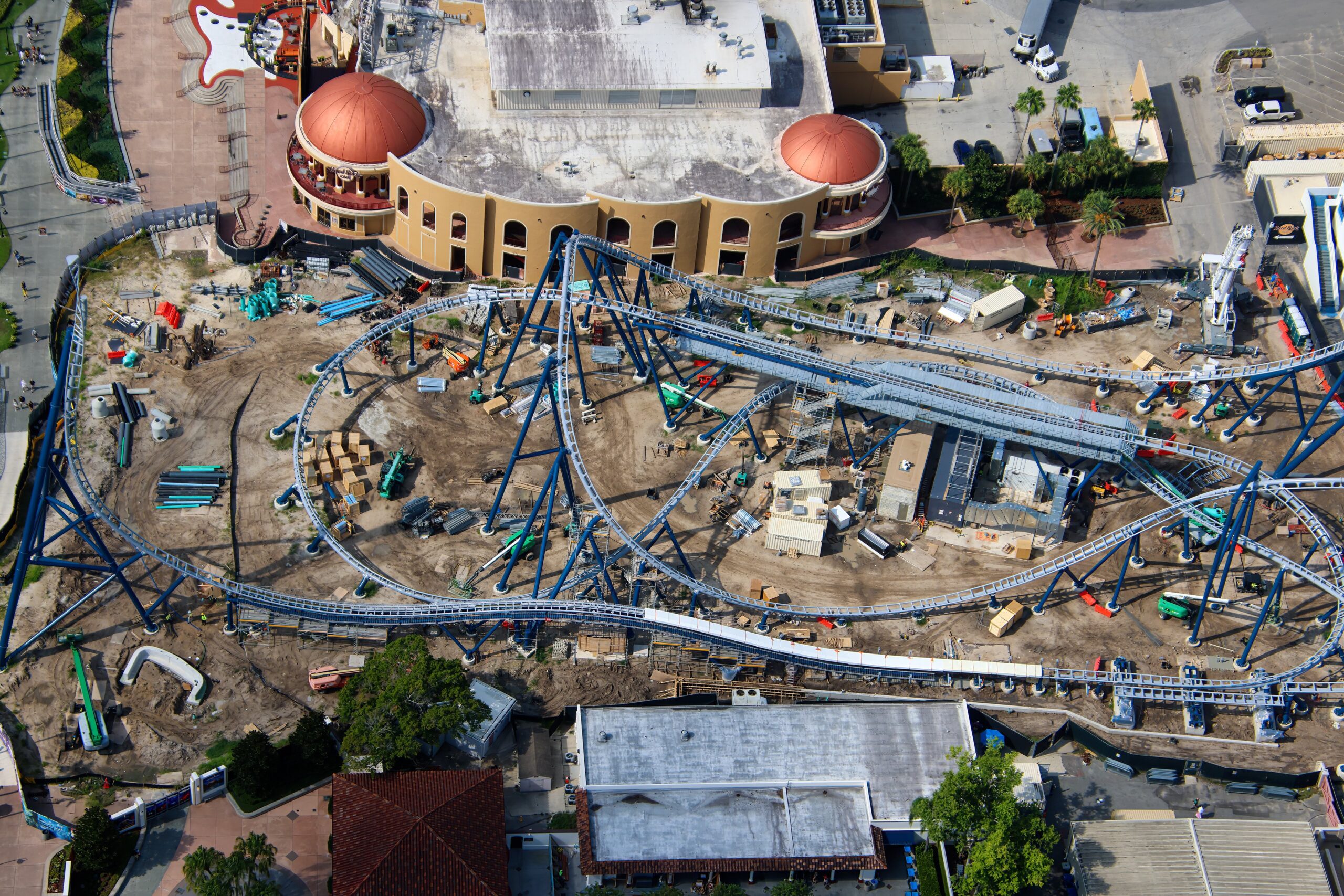 Aerial photographer bioreconstruct shared new views of the sprawling construction site, offering some of the clearest looks yet at the attraction’s interconnected track, station, launch, and maintenance areas.