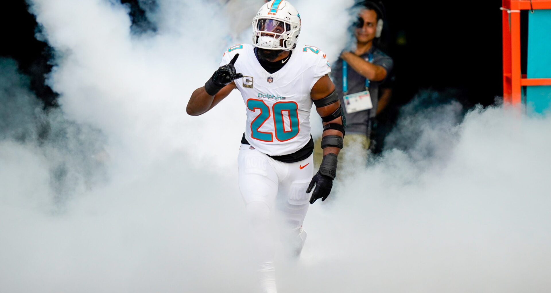 Nov 9, 2025; Miami Gardens, Florida, USA; Miami Dolphins linebacker Jordyn Brooks (20) runs on the field before a game against the Buffalo Bills at Hard Rock Stadium.